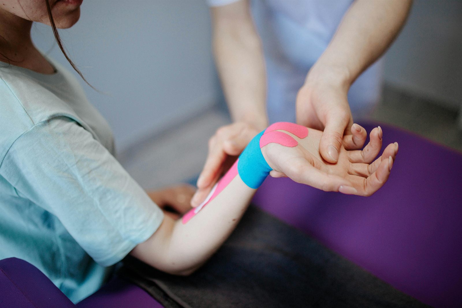 A Saddle Health clinician providing in-home care to a clinical trial subject.