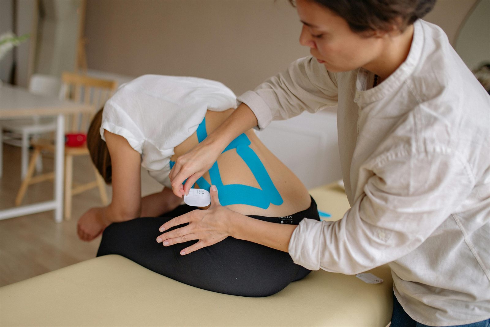 A Saddle Health clinician providing in-home care to an older adult resident.
